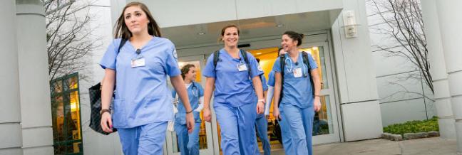 A group of young nurses walk together.