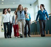 Group of employees walking on Level 5 East Mall