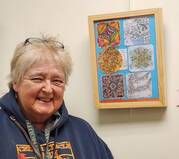 Suzi Rump, artist with her artwork at Aging Resource Center Art Show