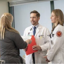 An APP Fellow talking to other providers