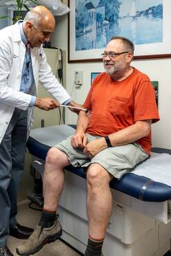 Dr. Vijay Thadani performs a neurologic exam on a patient.