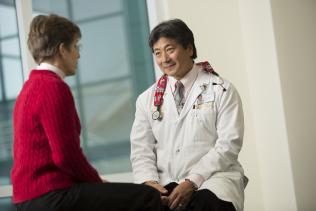 Alan Kono, MD, with patient
