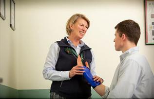 Hand therapist helps patient