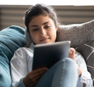 Woman using MyDH on computer