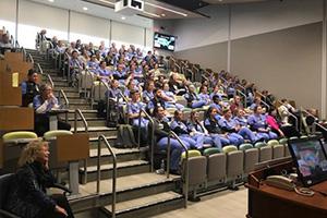 Continuing Medical and Nursing Education students in a D-H auditorium