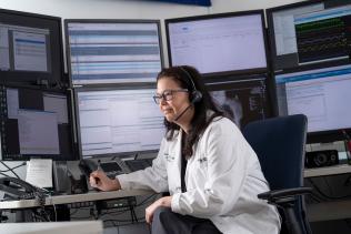 TeleICU provider surrounded by screens