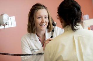 Jillian Belmont, APRN, with a patient