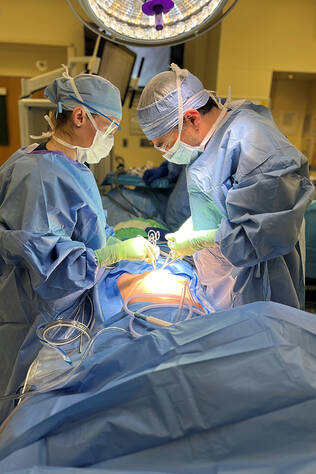 Two cardiothoracic surgeons performing surgery