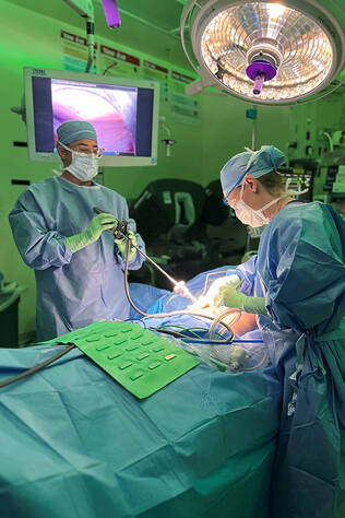 Two cardiothoracic surgeons performing surgery