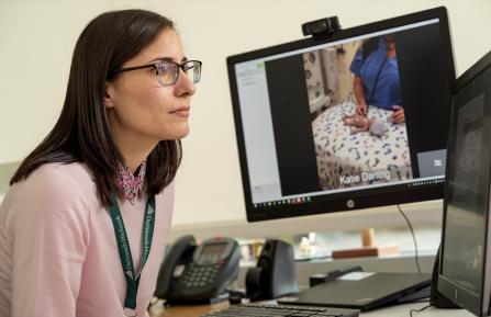 Michele Tyler, MD, looking at computer screen