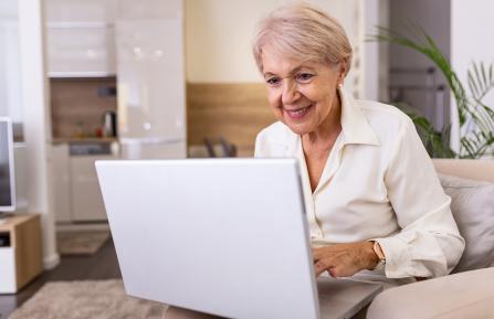Older woman working on a computer.