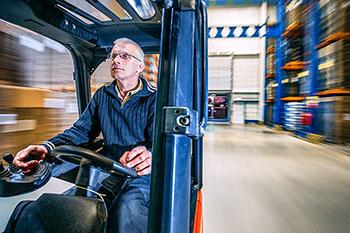 man driving forklift