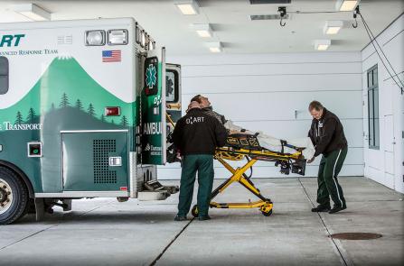 EMT's unload a patient from a DHART ambulance