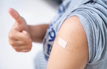 Photo of arm with band aid.