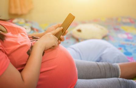 Pregnant woman with cellphone
