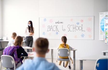 Kids sitting in a classroom.