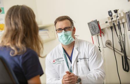 Greg Dadekian with patient.