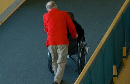 picture of volunteer wheeling patient