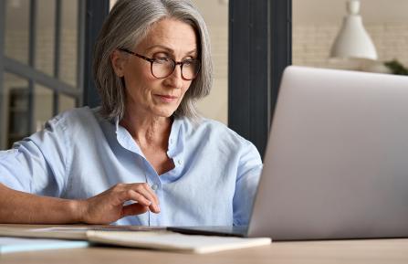 Woman working at a laptop.
