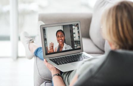 women on computer for a virtual visit with doctor