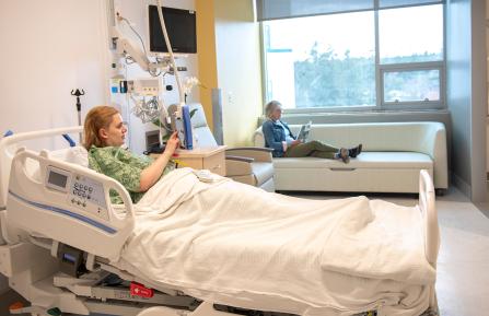 Patient in a bed in the new DHMC Patient Pavilion