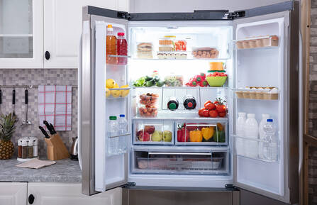 A refrigerator with its doors open.