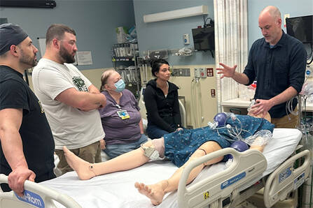 Neurology and Neurocritical Care APP students watching a demonstration