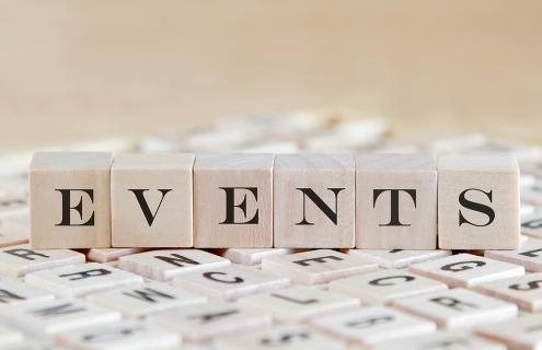 Letter tiles spelling out the word events