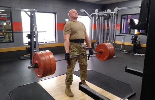 Adam Dumont lifting weights