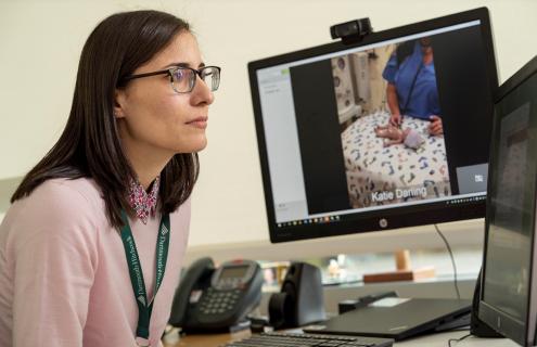 Michele Tyler, MD, looking at computer screen
