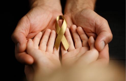 Child and parents hands.