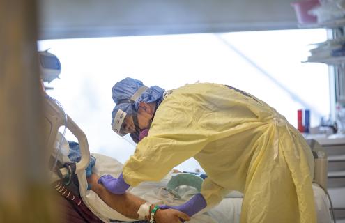 Clinical nurse caring for COVID-19 patient