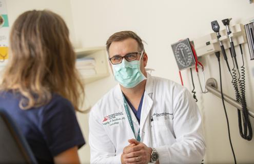 Greg Dadekian with patient.
