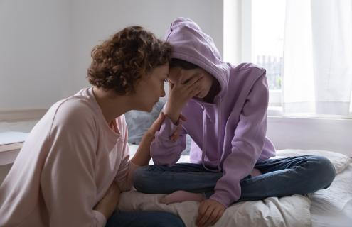 Mother talking to daughter