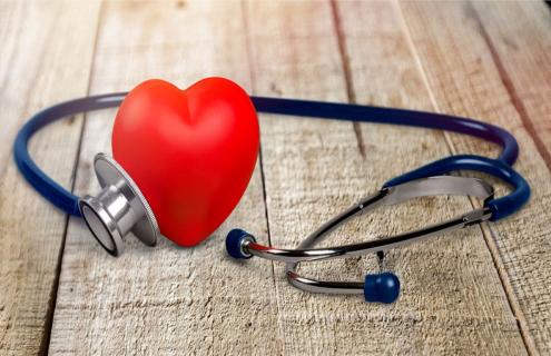 A red heart with a stethoscope around it