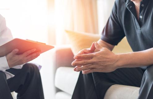 picture of man talking to doctor