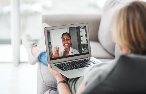 women on computer for a virtual visit with doctor
