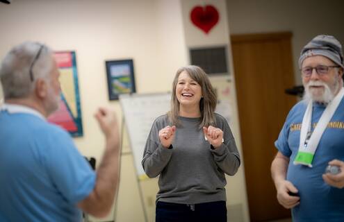 Kristen Frechette, RN, works with two patients