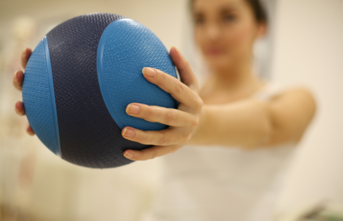 Woman holding medicine ball