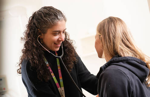 Emily Zeitler, MD, MHS, with a patient.
