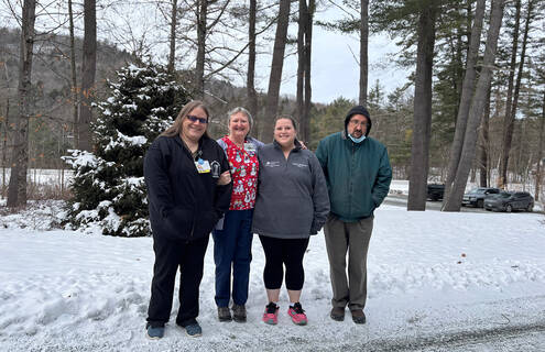 Sammie Druckenmiller, MSN, RN; Judy Belyea, LNA; Jessica Hill, MA II; and Cameron Greatorex, Receptionist who are standing outside the Dartmouth Hitchcock Lyme Clinic.