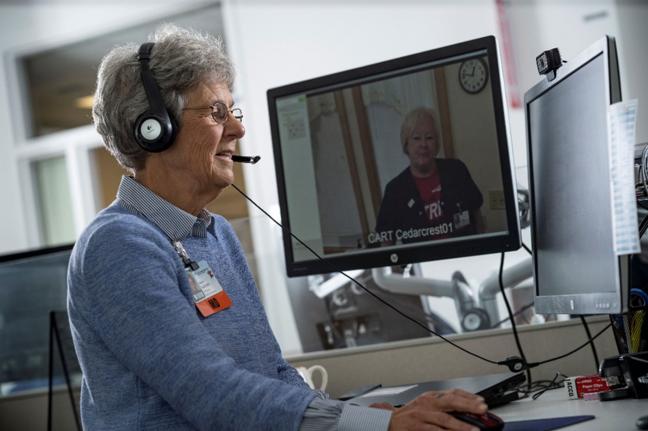 A provider works with a patient over a computer.