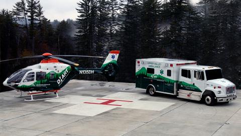 DHART helicopter and ambulance on helipad
