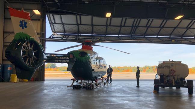 DHART helicopter in a hangar.