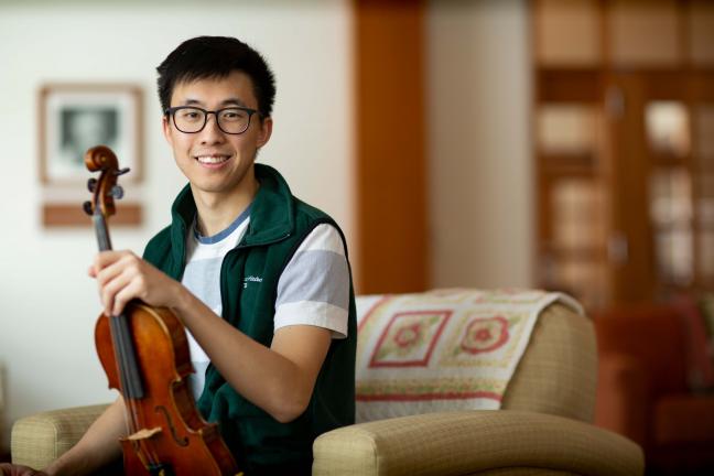 D-H volunteer Bryan Shin with his violin