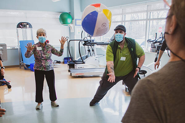 Participants work as a group to keep a beach ball off the ground