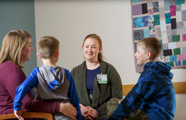CHaD social worker Meg Harkins MSW speaks with a family