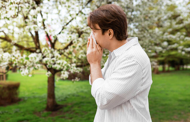 Picture of man sneezing