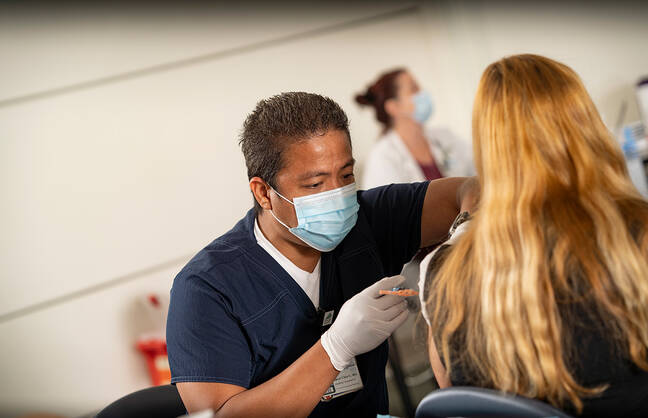 Woman getting a vaccine