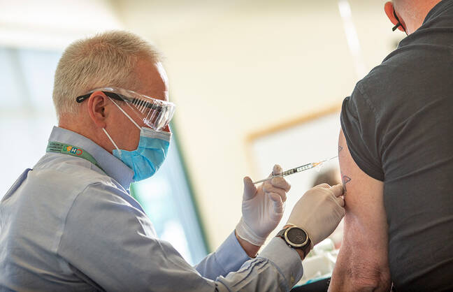 Dr giving a covid shot